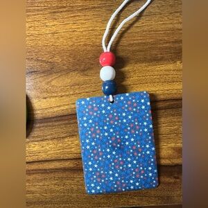 Red, white, and blue car air freshener, cool breeze scent